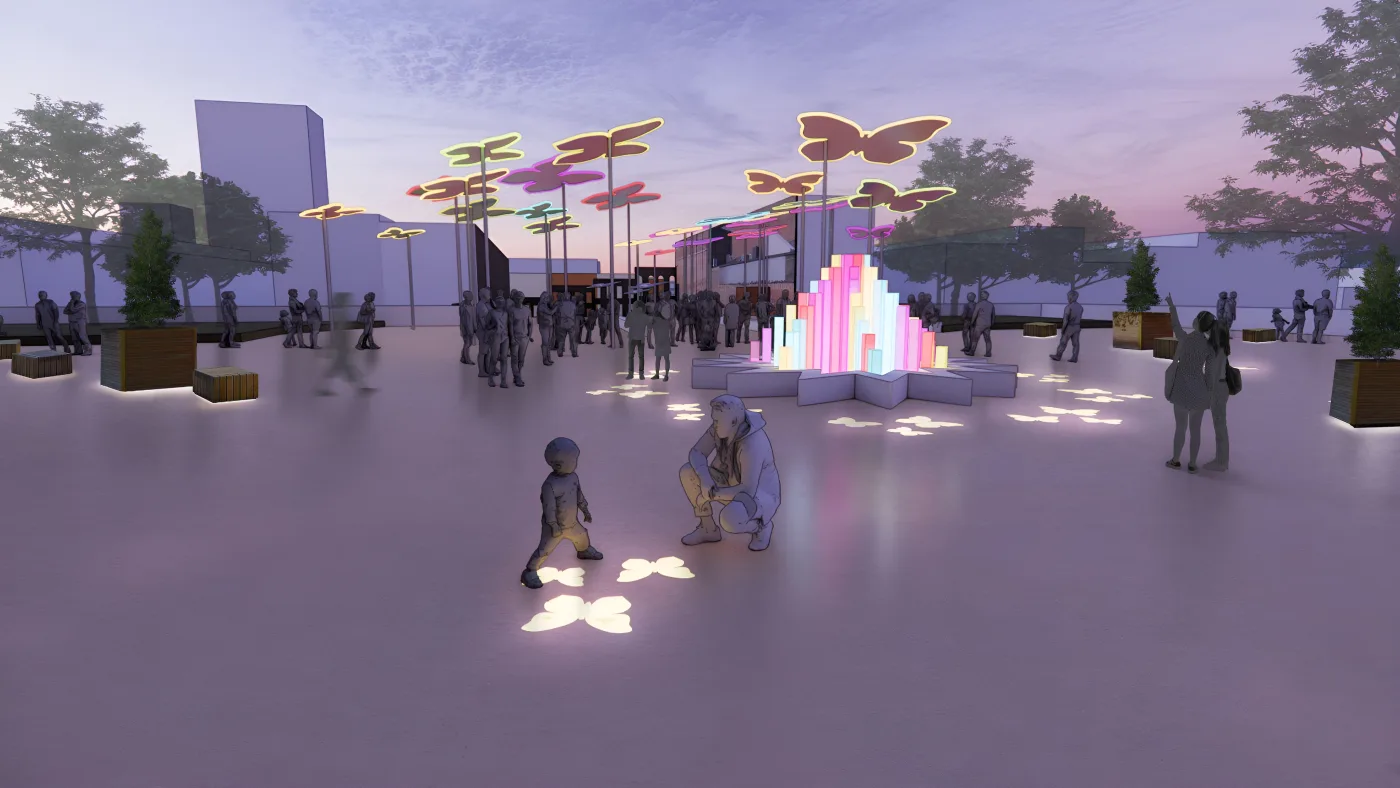 A plaza at dusk with butterfly-shaped canopies on tall poles, butterfly patterns of light on the ground and a glowing fountain sculpture