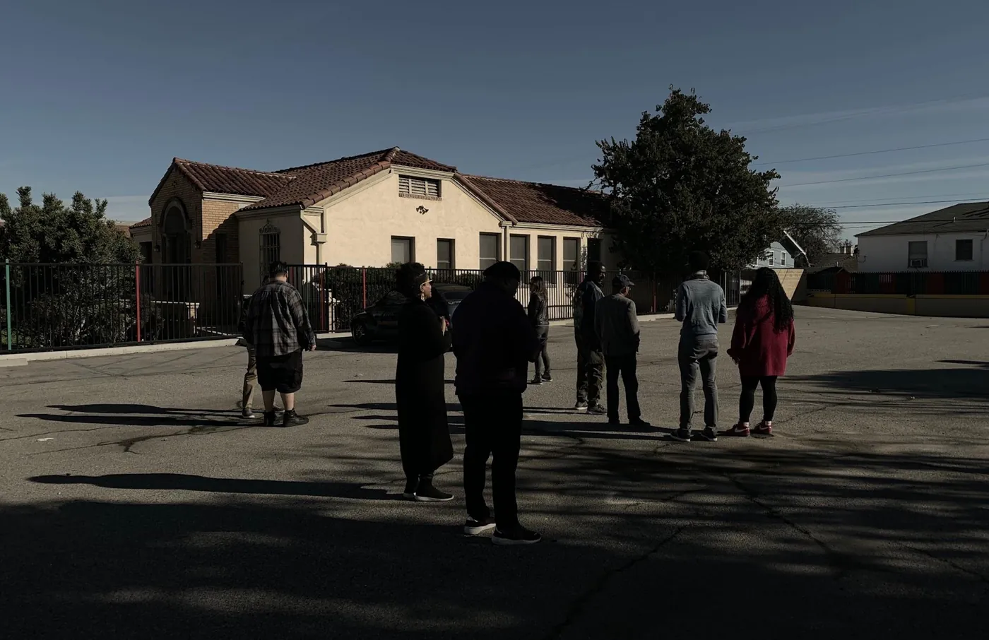 Workshop participants standing in the Firestation parking lot in late-afternoon light