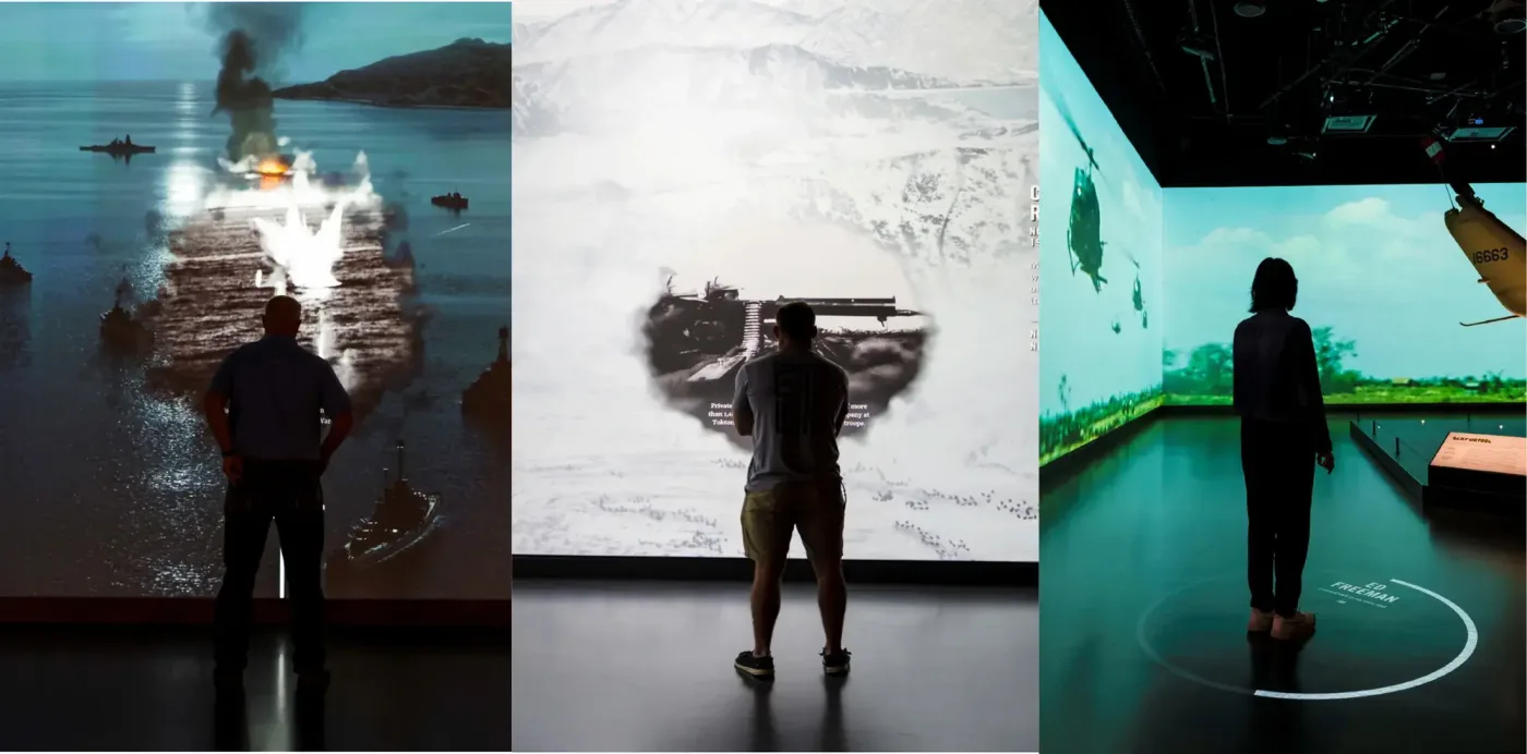 Three views of visitors standing in immersive battlefield projections